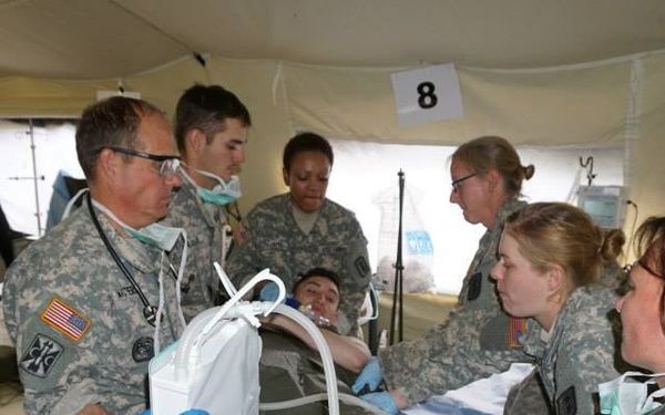 EMT personnel transferring patients to the ICU