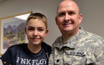 Hero son receives award for saving father