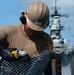 Sailors work to repair the floating dock next to the USS Arizona Memorial