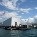 Sailors work to repair the floating dock next to the USS Arizona Memorial