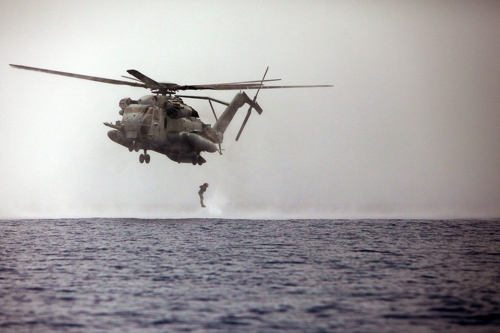 MRF Marines jump from a CH-53E Super Stallion during helo-cast training in the Gulf of Aden