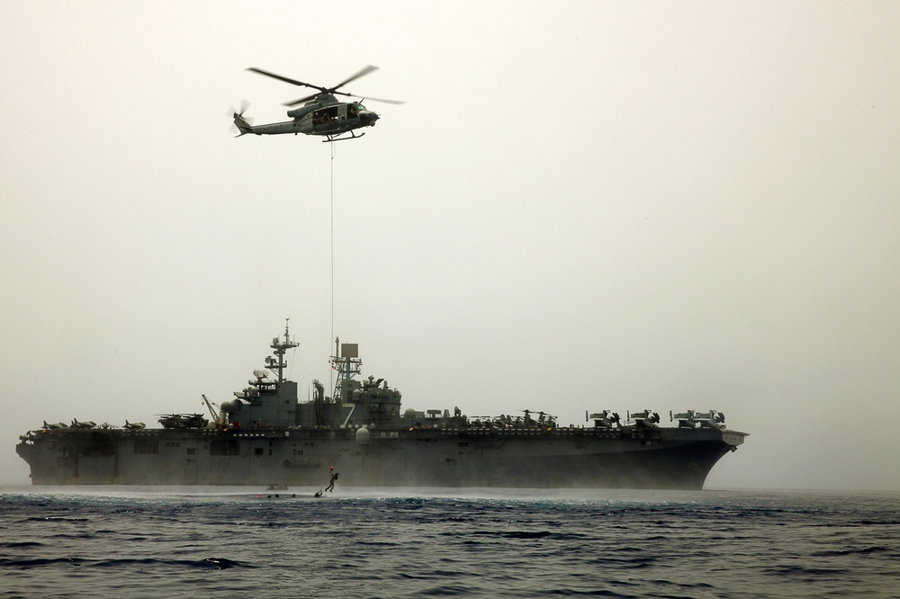 MRF Marines jump from a CH-53E Super Stallion during helo-cast training in the Gulf of Aden