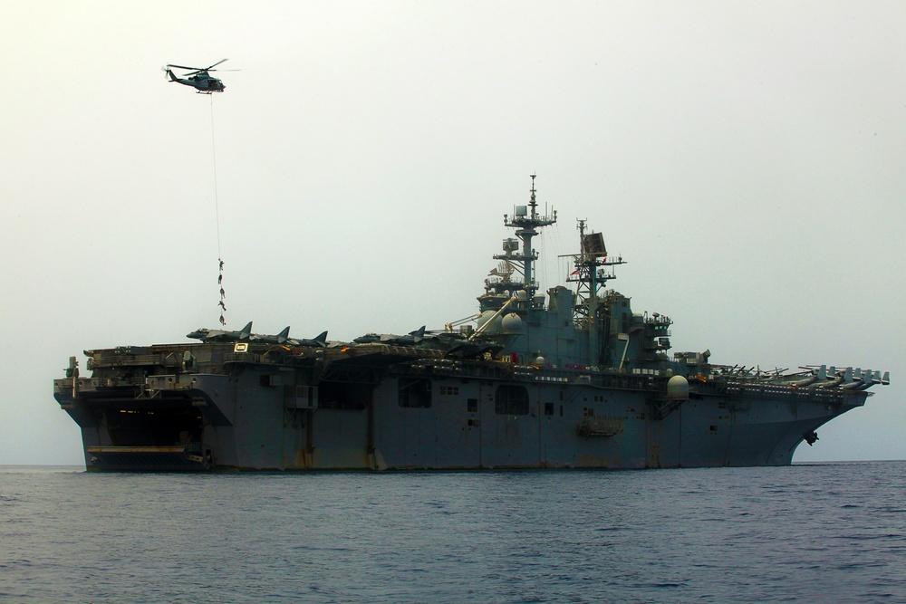 MRF Marines jump from a CH-53E Super Stallion during helo-cast training in the Gulf of Aden