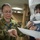 Multi-national military medical personnel conduct M95 respirator fit testing aboard USNS Mercy