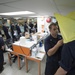 Multi-national military medical personnel conduct M95 respirator fit testing aboard USNS Mercy