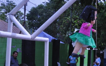 Dora explores at a free medical campaign in Nejapa, El Salvador