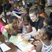 Pacific Partnership service members read to students in Kiribati