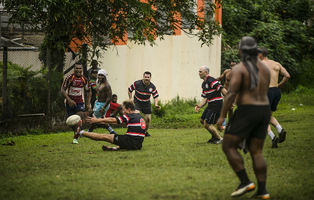 Americans and Fijians play rugby during Pacific Partnership 2015