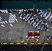 The president of Fiji receives honors during a ceremony for Pacific Partnership 2015