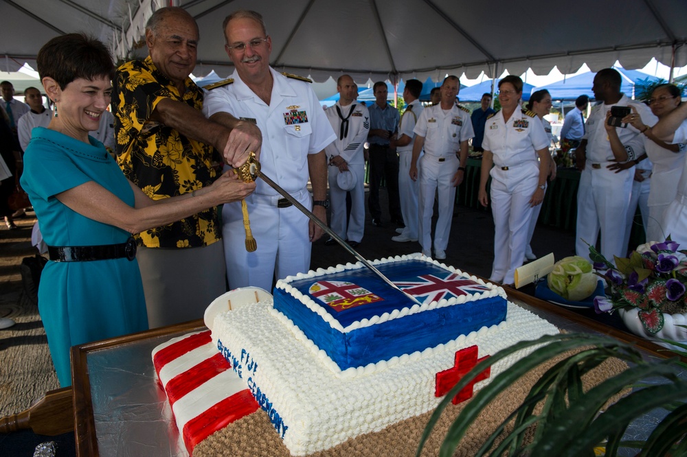 The president of Fiji and the US ambassador to Fiji cut a cake during a ceremony for Pacific Partnership 2015