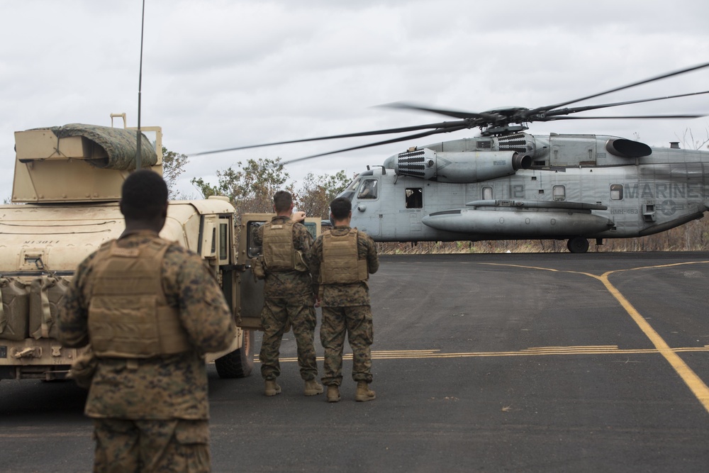 Marines with MRF-D  assist in the refueling of vehicles by helicopter