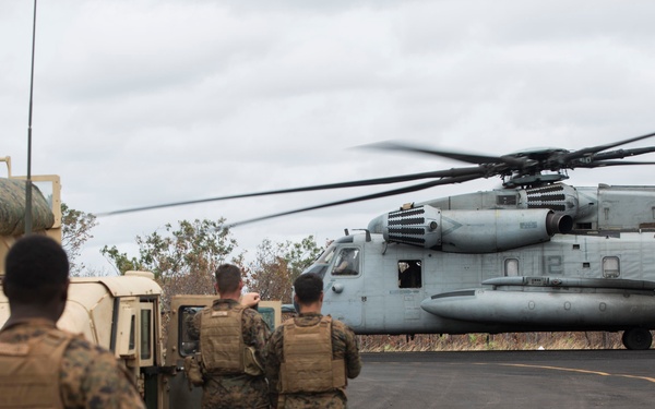 Marines with MRF-D  assist in the refueling of vehicles by helicopter