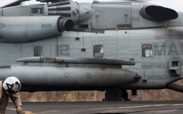 Marines with MRF-D  assist in the refueling of vehicles by helicopter
