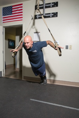 Fire personnel aboard Marine Corps Logistics Base Barstow, Calif., engage in various types of workouts, but lately, they have taken 'hanging out at the gym' to a whole new level with TRX suspension training