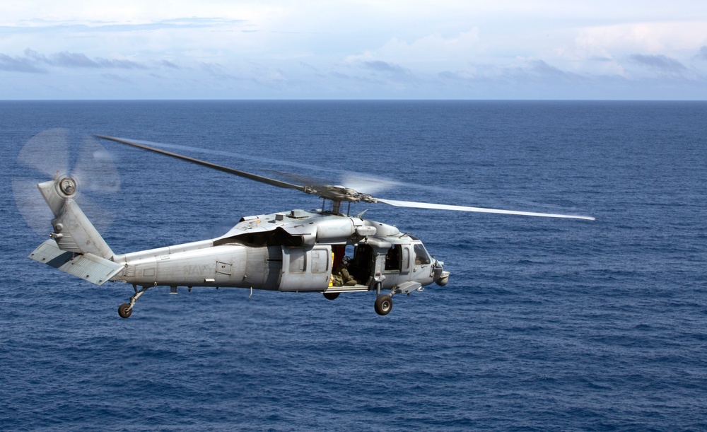 U.S. Marine Harrier pilots ensure landing skills are sharp at sea