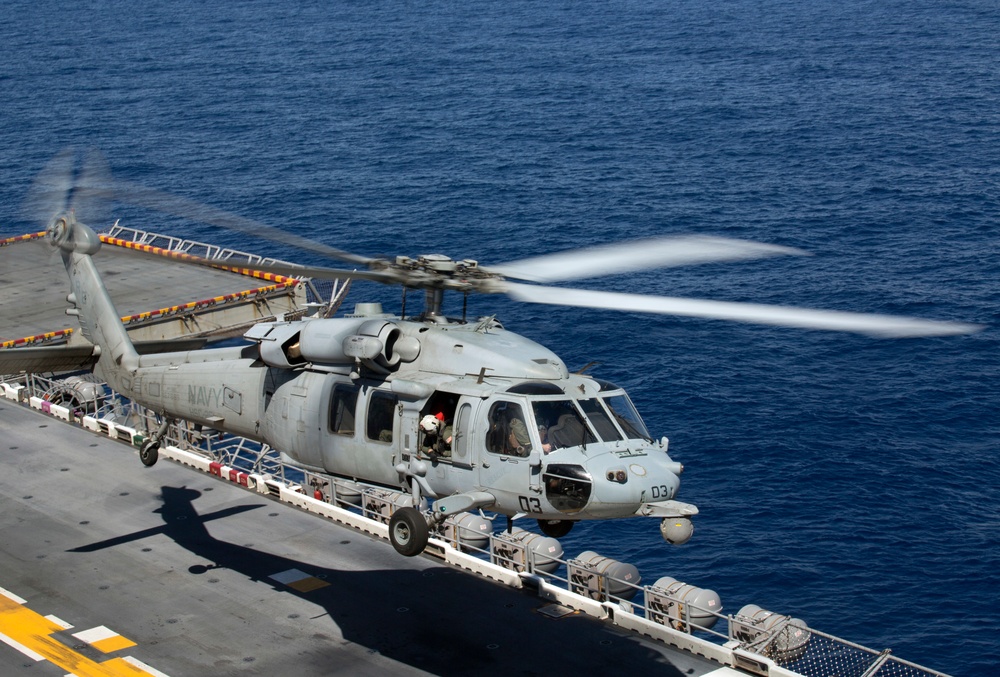 U.S. Marine Harrier pilots ensure landing skills are sharp at sea