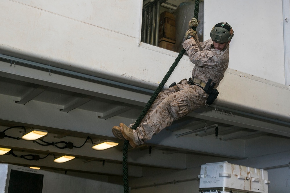 U.S. Marines practice safely going from air to ship while at sea