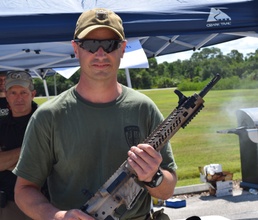 "D-Day Shoot-Out" top shooter poses with his prize