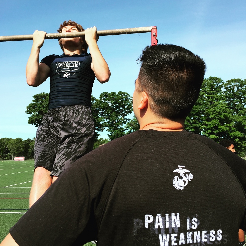 Marines put New England high school football players through their paces during the Semper Fidelis All-American Camp