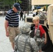 Army Reserve soldier gears up child for the Army's 240th birthday