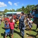 Members of the Pacific Fleet Band perform for Fijian children