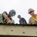 Military engineers from the US and Japan help build a children's classroom at Wailevu, Fiji