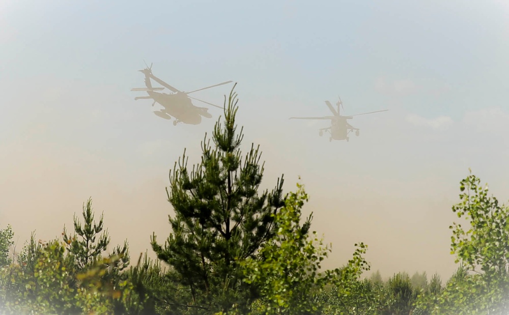 Apache helicopters provide air support for multinational forces during Saber Strike 15
