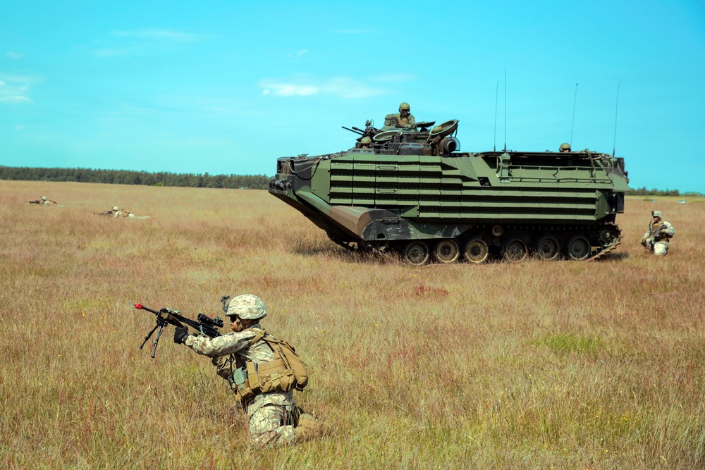 Mechanized and dismounted movement following a beach assault in Sweden by U.S. Marines