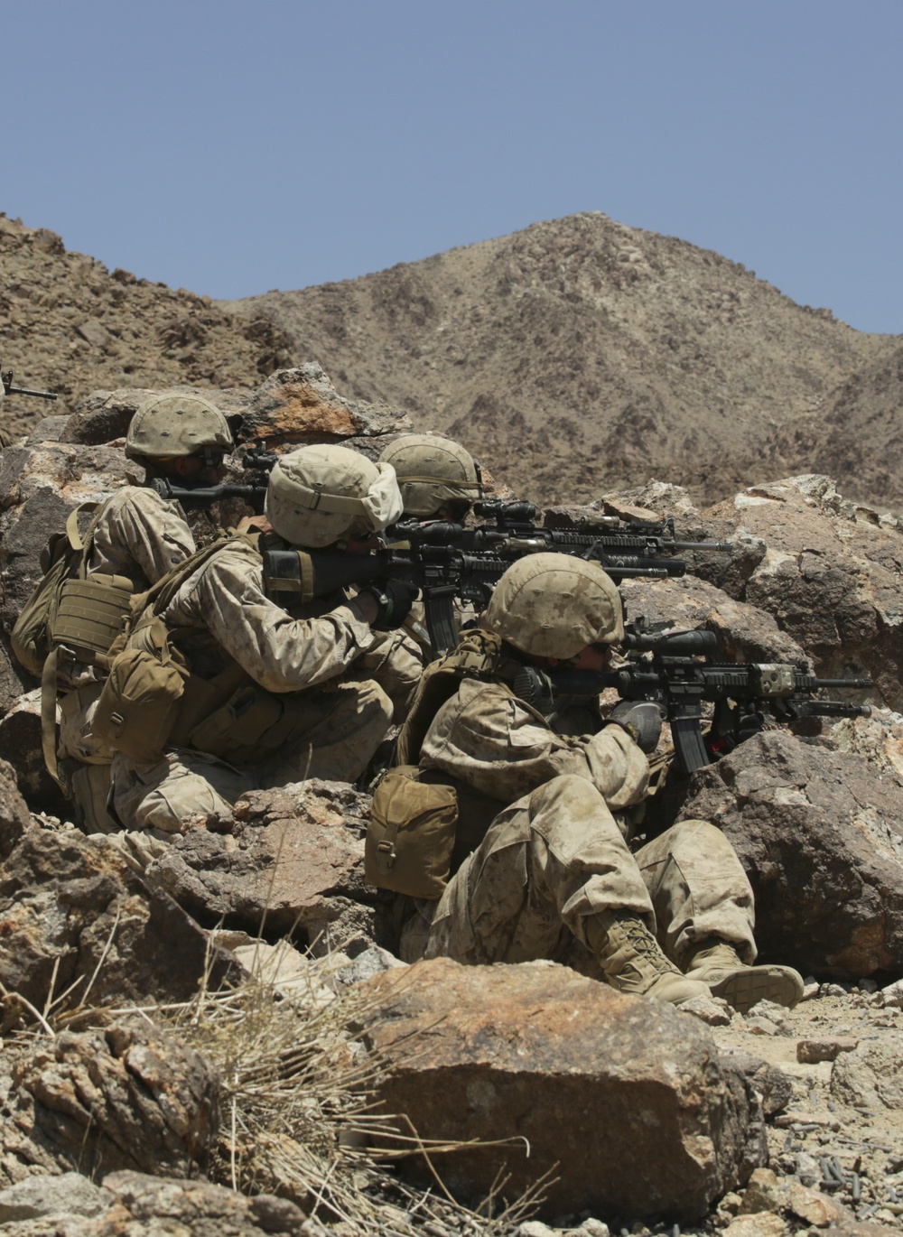 Marines move and shoot down range in cooperative exercise