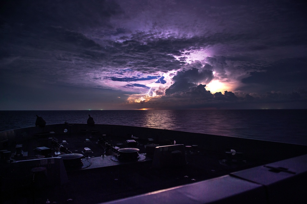 USS Anchorage navigates between storms