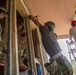 Engineers from US Air Force, Japan Ground Self Defense Force and Fiji military build a classroom during Pacific Partnership 2015