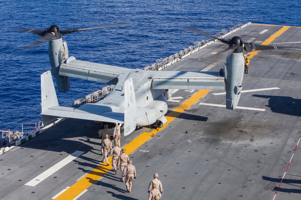Marines practice fast roping on ship