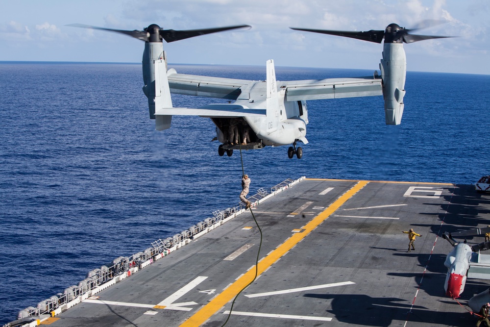 Marines practice fast roping on ship