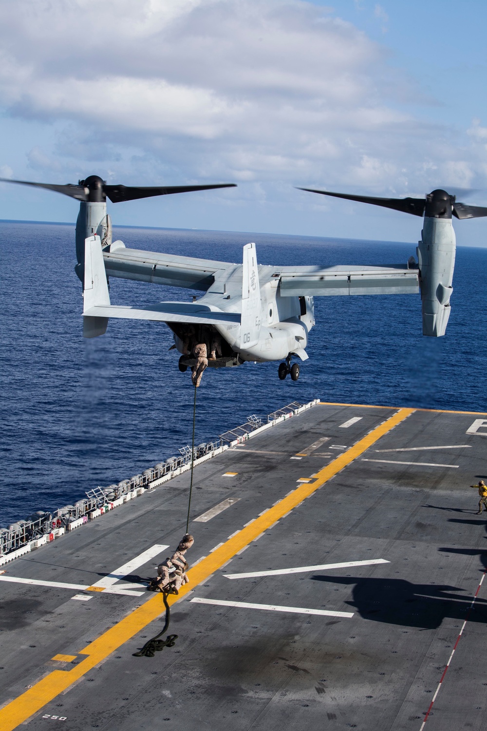 Marines practice fast roping on ship