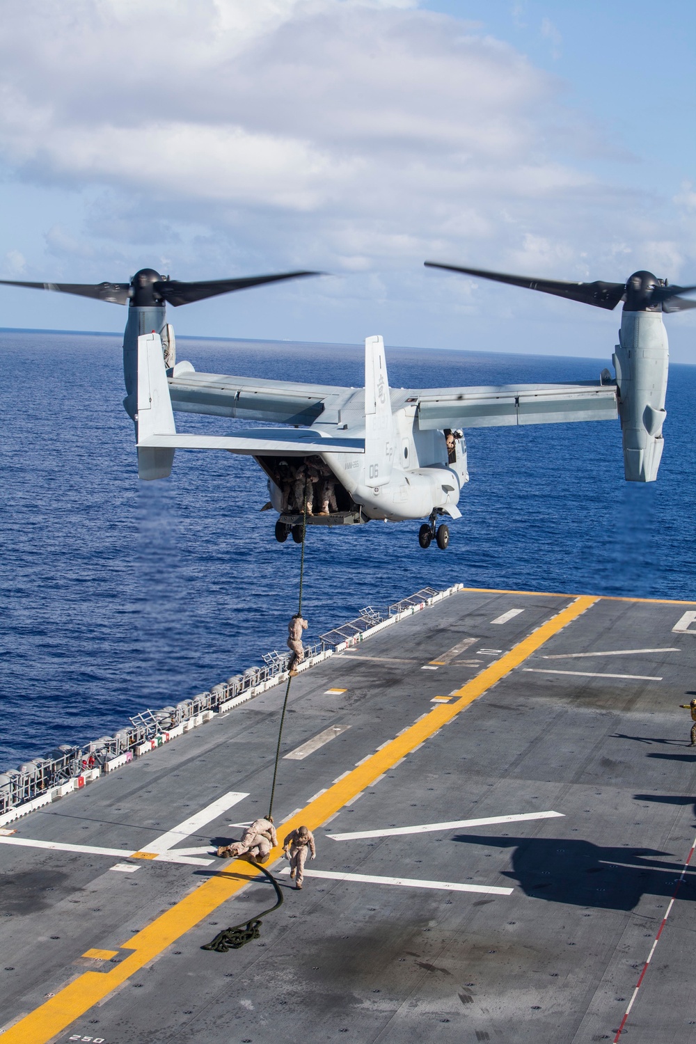 Marines practice fast roping on ship