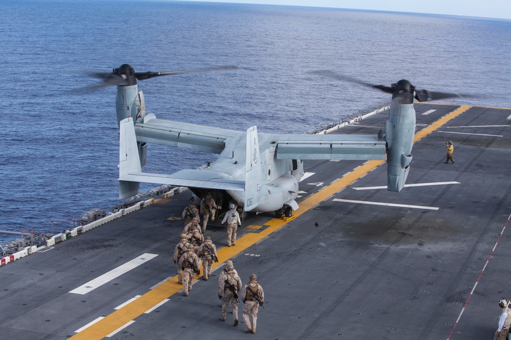 Marines practice fast roping on ship