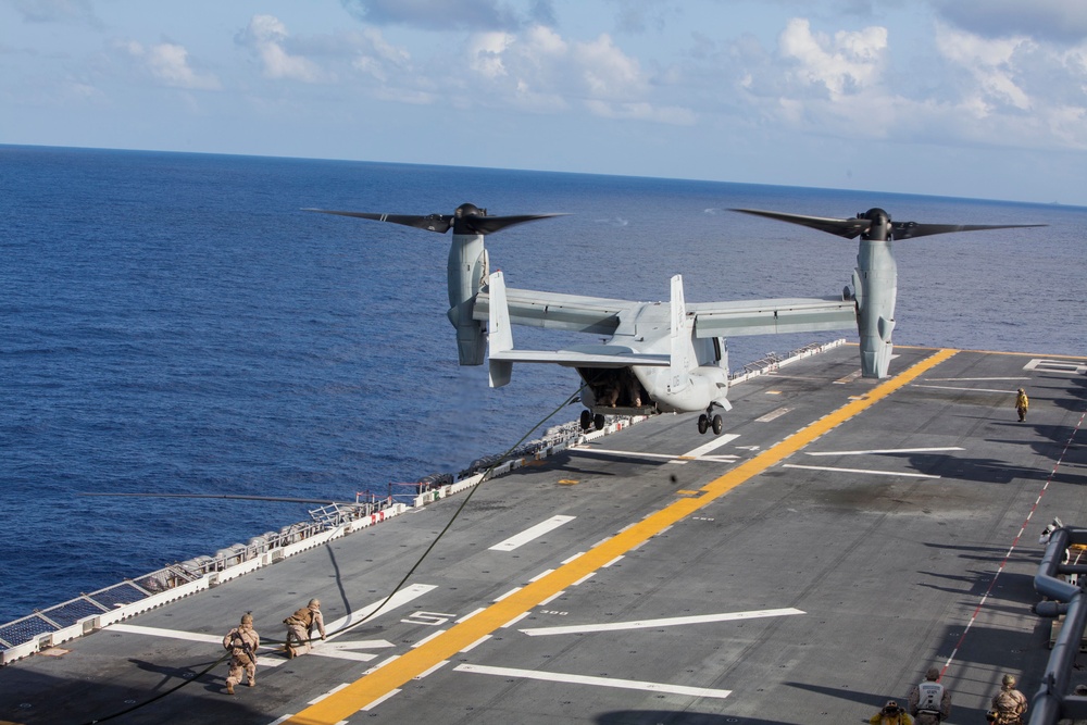 Marines practice fast roping on ship