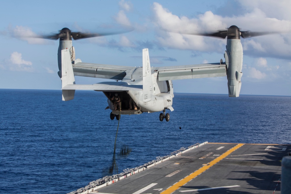 Marines practice fast roping on ship