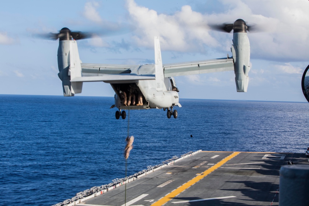 Marines practice fast roping on ship