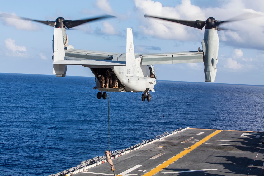 Marines practice fast roping on ship