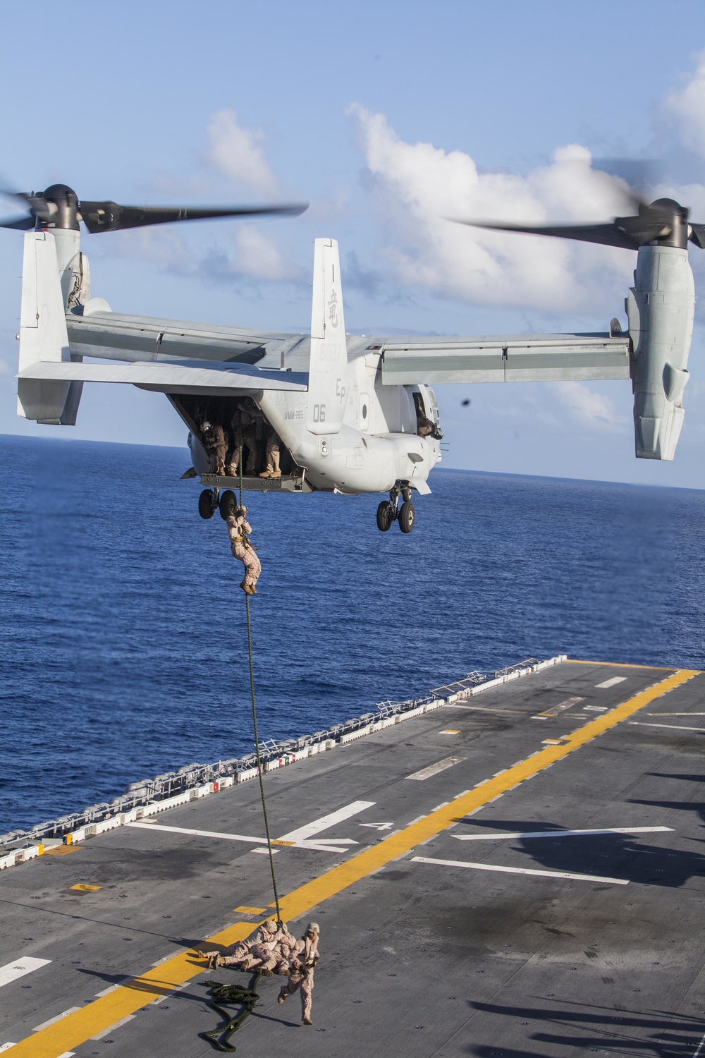 Marines practice fast roping on ship