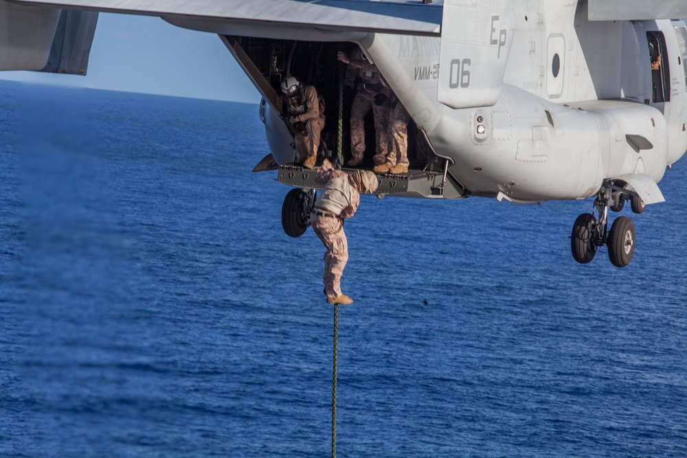 Marines practice fast roping on ship