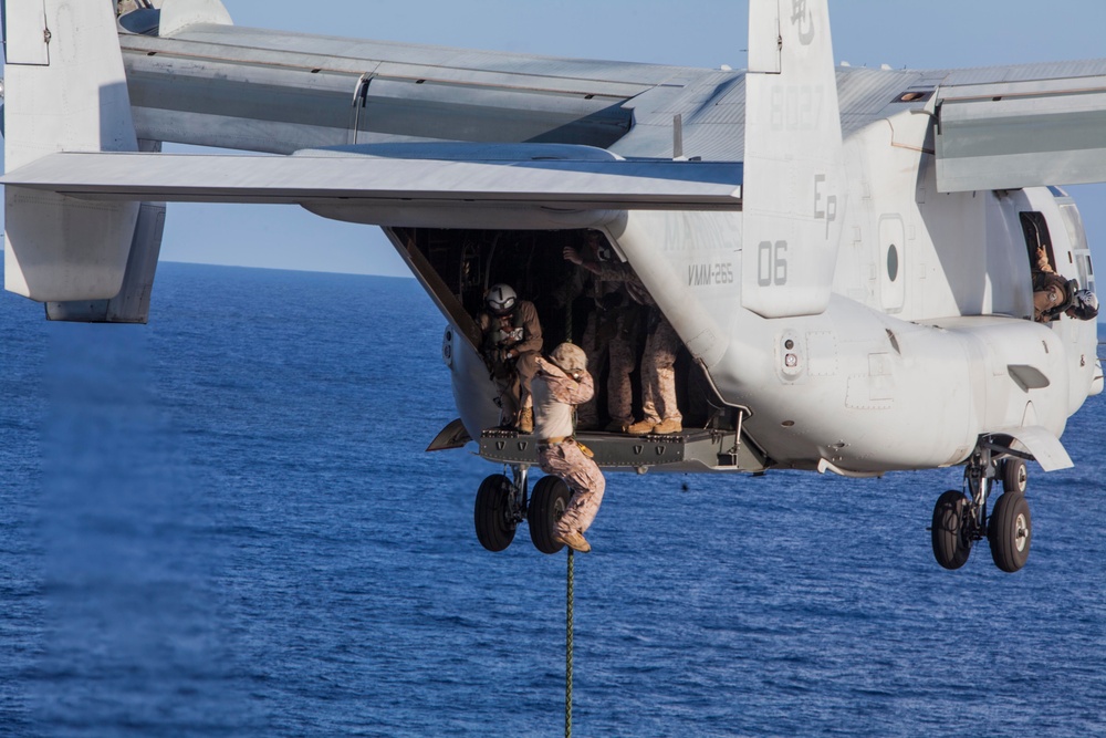 Marines practice fast roping on ship