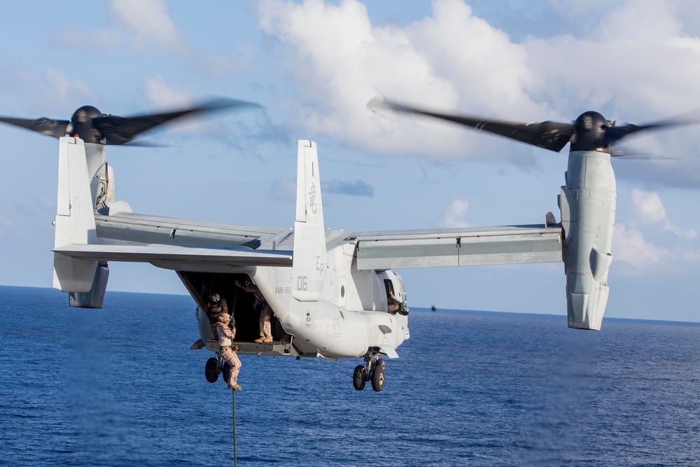 Marines practice fast roping on ship