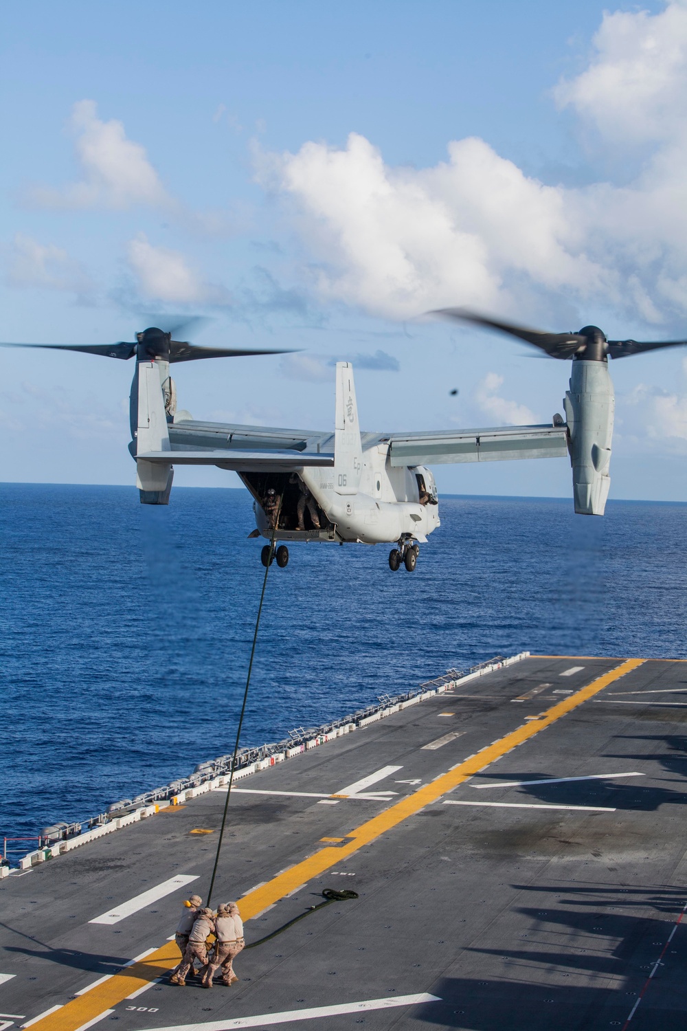 Marines practice fast roping on ship