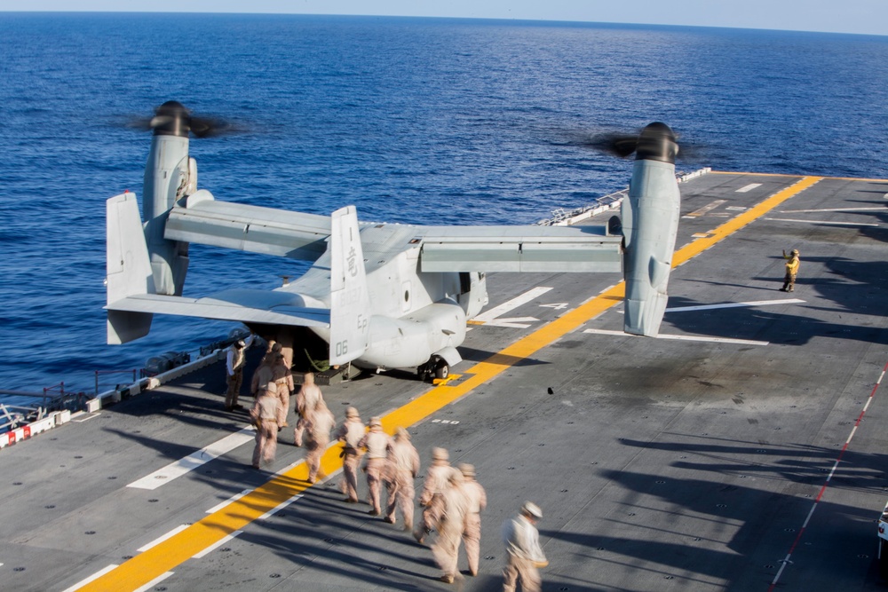 Marines practice fast roping on ship