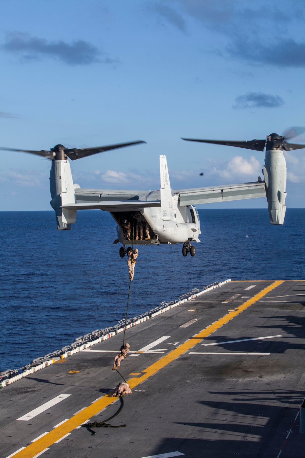 Marines practice fast roping on ship