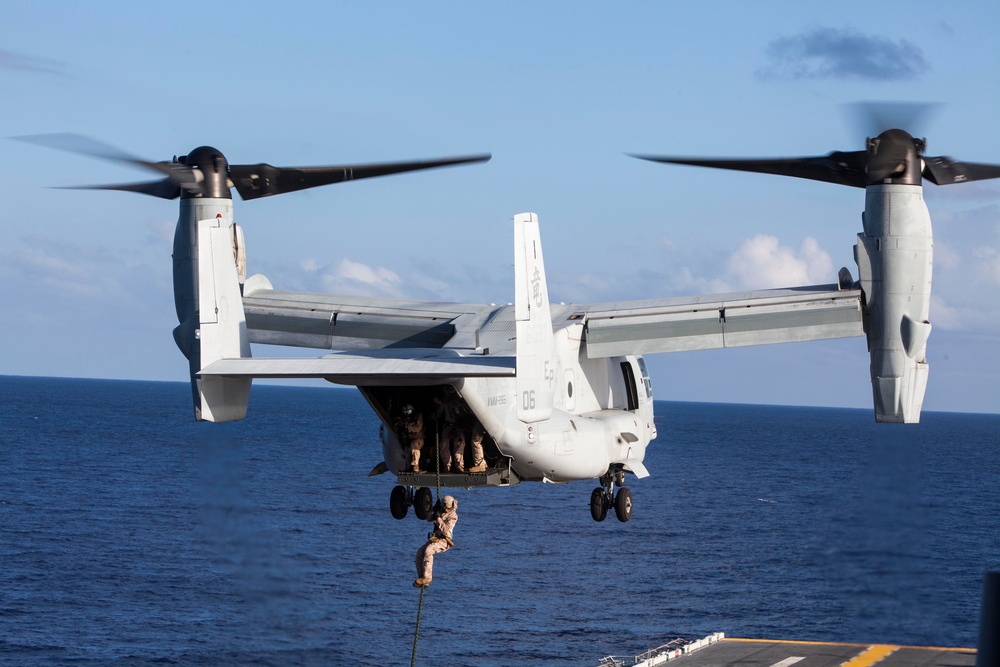 Marines practice fast roping on ship