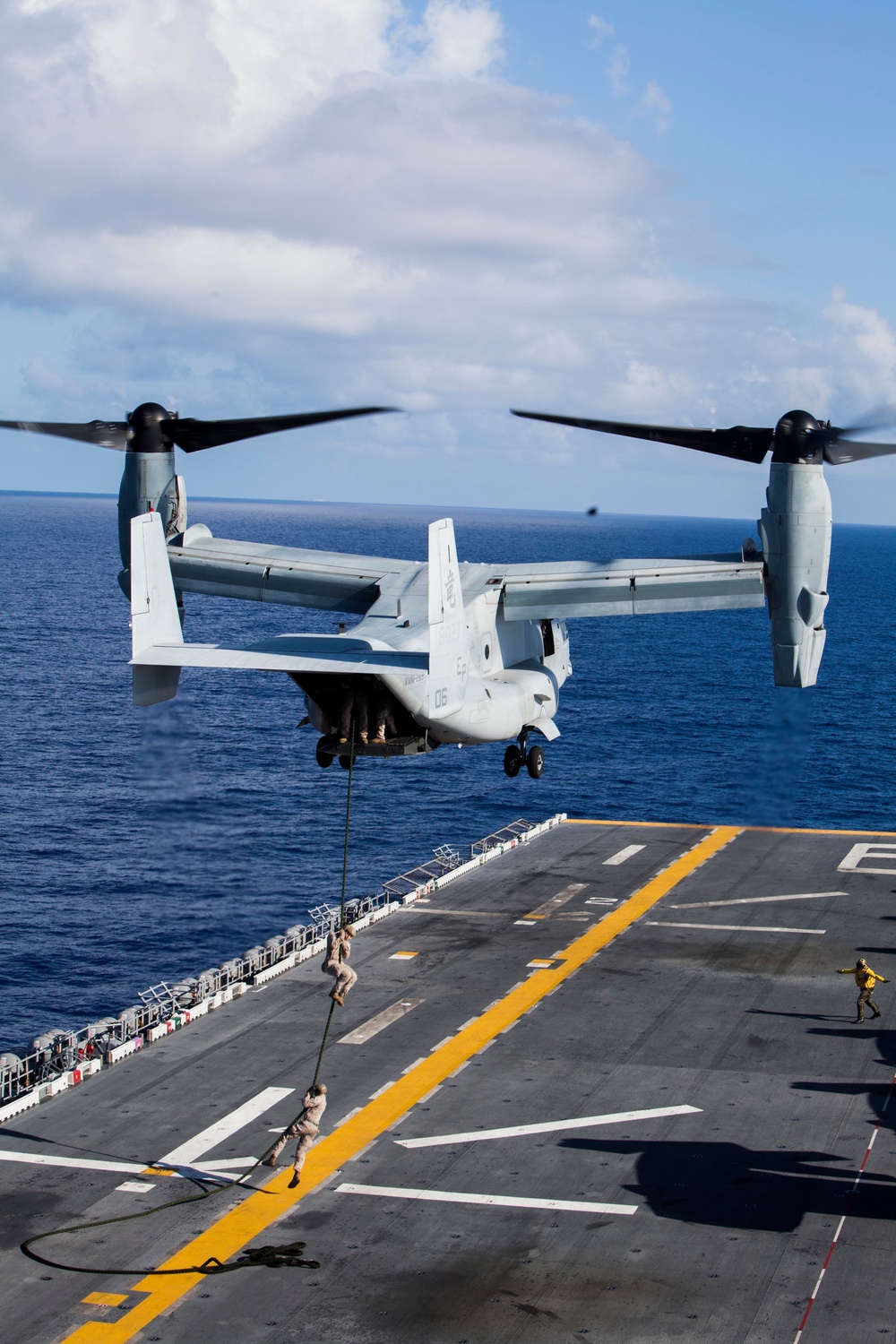 Marines practice fast roping on ship