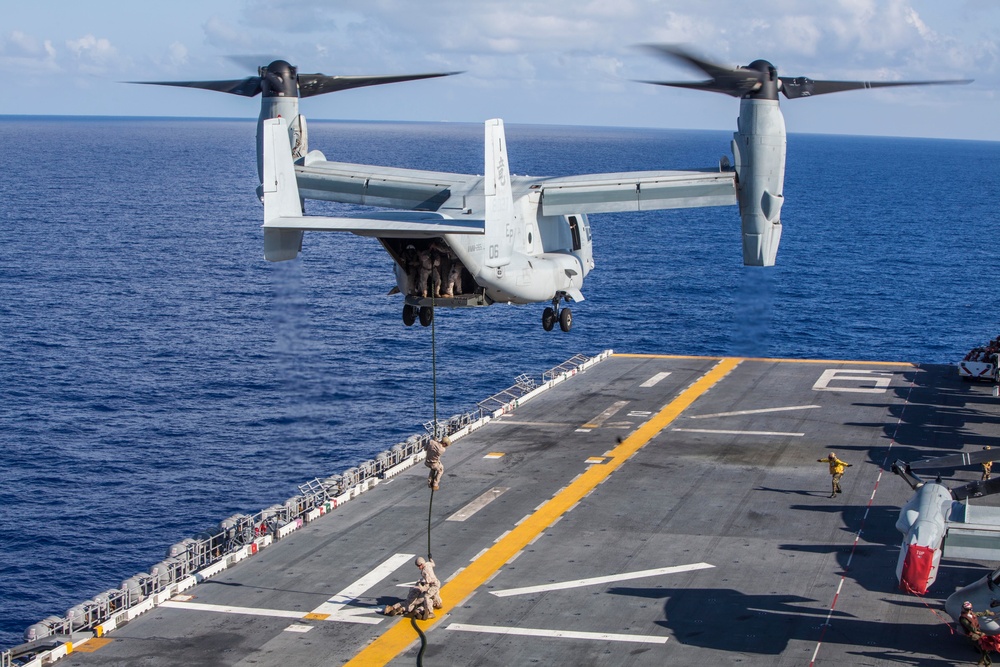 Marines practice fast roping on ship